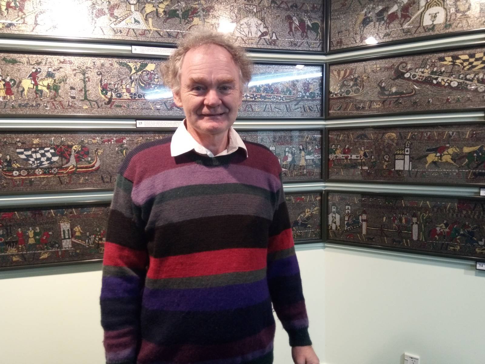 Michael Linton in front of his incredible re-creation of the 1066 Bayeux Tapestry.